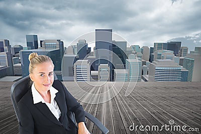 Businesswoman sitting on swivel chair with laptop Stock Photo