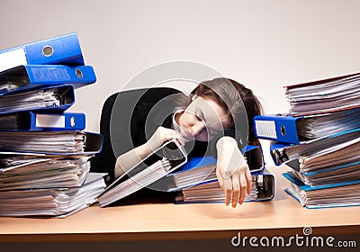 Businesswoman sleeping at office Stock Photo