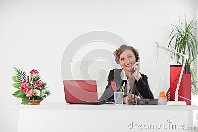 Businesswoman speaks by phone. Stock Photo