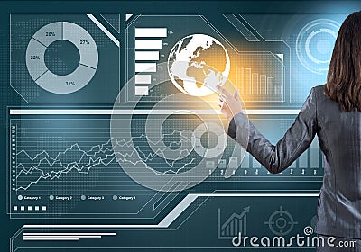 Businesswoman standing with back and pressing icon on media screen Stock Photo