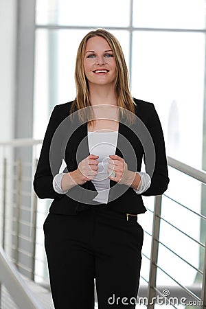 Businesswoman standing in a modern Building Stock Photo