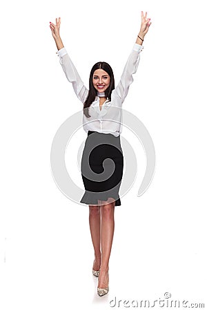 Businesswoman stepping forward and celebrating with hands in the Stock Photo