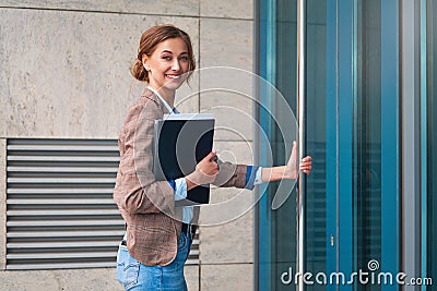 Businesswoman successful woman business person standing outdoor corporate building exterior. Pensiv caucasian confidence Stock Photo