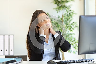 Businesswoman suffering neck pain Stock Photo