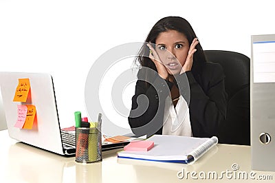 Businesswoman suffering stress working at office computer desk worried desperate Stock Photo