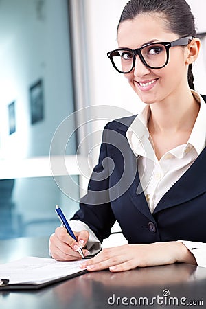 Businesswoman taking notes Stock Photo