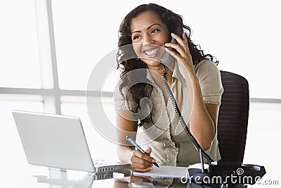 Businesswoman taking telephone call Stock Photo