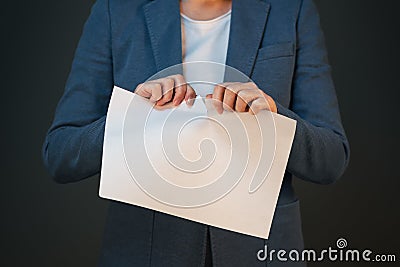 Businesswoman tearing business legal agreement contract Stock Photo