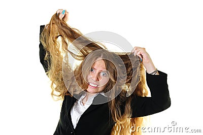 Businesswoman tearing her hair Stock Photo