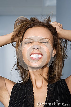 Businesswoman tearing her hair out Stock Photo