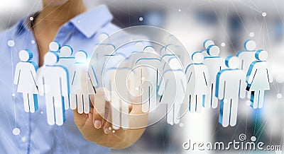 Businesswoman touching 3D rendering group of people with her fin Stock Photo