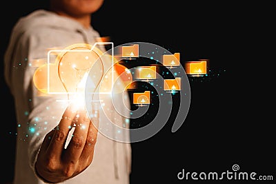 Businesswoman touching light bulb and icon Cloud Computing. Stock Photo