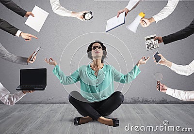 Businesswoman tries to keep calm with yoga due to stress and overwork at wok Stock Photo