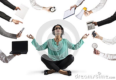 Businesswoman tries to keep calm with yoga due to stress and overwork at wok Stock Photo