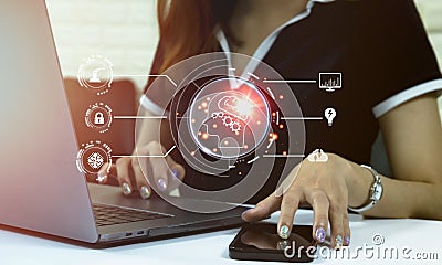 Businesswoman using smartphone and laptop computer connecting virtual ai smart brain assistant technology. Artificial Intelligence Stock Photo