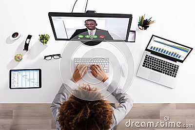 Businesswoman Video Conferencing With Colleague On Computer Stock Photo