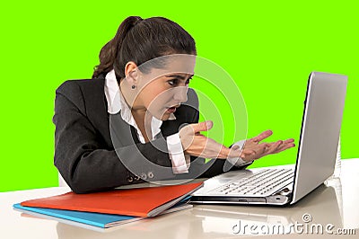 Businesswoman wearing business suit working on laptop computer green chroma key Stock Photo