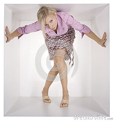 Businesswoman in the white cube Stock Photo