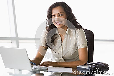 Businesswoman working at desk Stock Photo