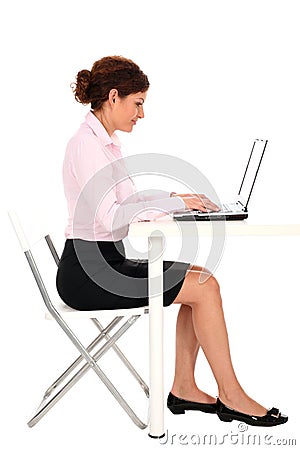 Businesswoman working on laptop Stock Photo