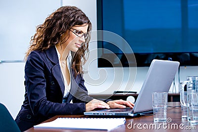 Businesswoman working on laptop Stock Photo