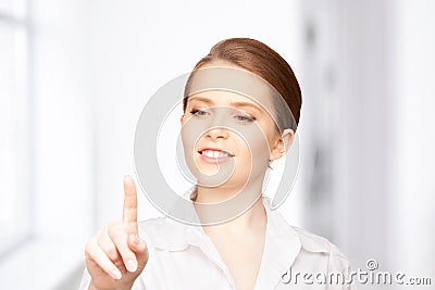 Businesswoman working with something imaginary Stock Photo