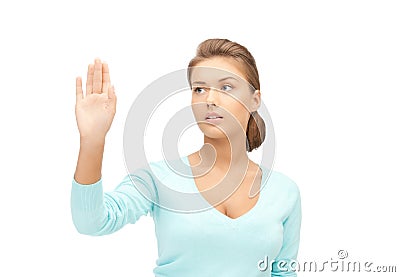 Businesswoman working with something imaginary Stock Photo