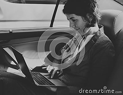 Businesswoman Working Using Laptop Car Inside Concept Stock Photo