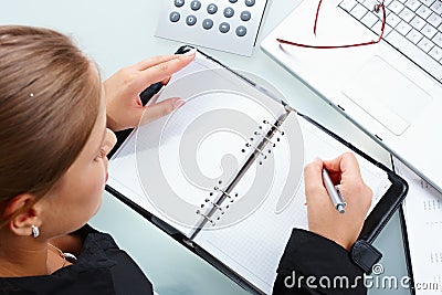 Businesswoman writing Stock Photo