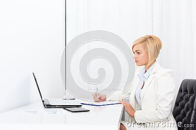 Businesswoman writing contract, signing document Stock Photo