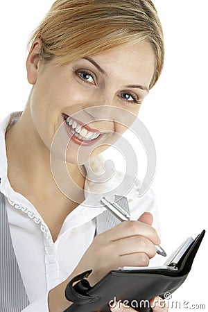 Businesswoman Writing In Diary Stock Photo