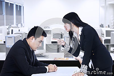 Businesswoman is yelling at her employee Stock Photo