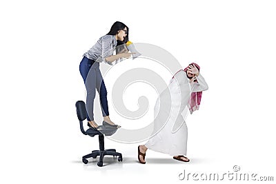 Businesswoman yelling with megaphone Stock Photo