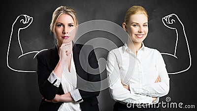 Businesswomen with drawing symbolizing power and teamwork Stock Photo