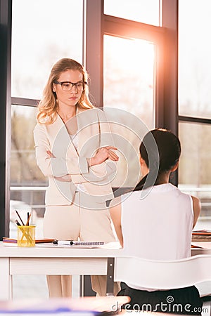 Businesswomen in formalwear talking at interview in modern office Stock Photo