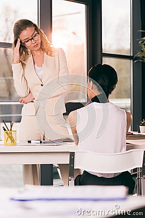 Businesswomen in formalwear talking at interview in modern office Stock Photo