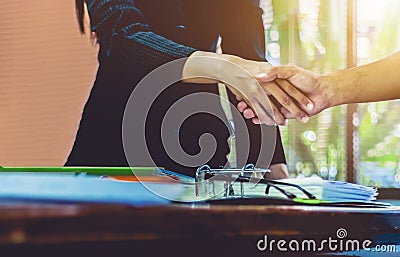 businesswomen handshaking businessmen succeed in the job Stock Photo