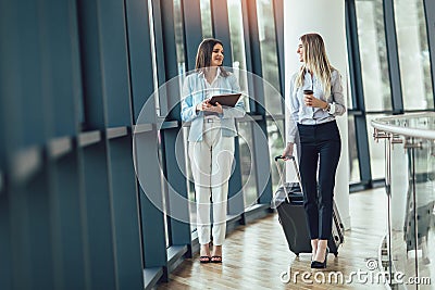 Young Businesswomen hold luggage travel to business trip Stock Photo