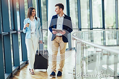 Businesswomen hold luggage travel to business trip Stock Photo