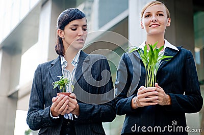 Businesswomen with Plants Stock Photo