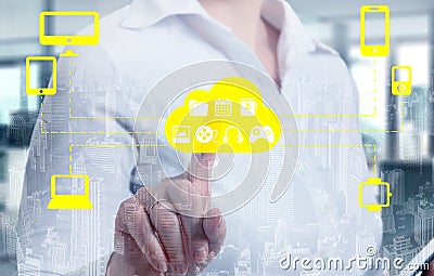 Businesswomen touching a cloud connected to many objects on a virtual screen, concept about internet of things Stock Photo