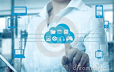 Businesswomen touching a cloud connected to many objects on a virtual screen, concept about internet of things Stock Photo