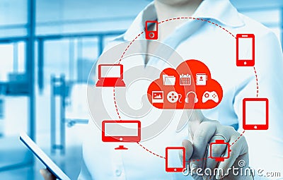 Businesswomen touching a cloud connected to many objects on a virtual screen, concept about internet of things Stock Photo