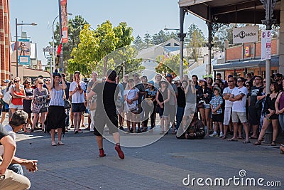 Busker Performing with Volunteer Editorial Stock Photo