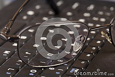 Bussines concept, glasses and keyboard. Stock Photo