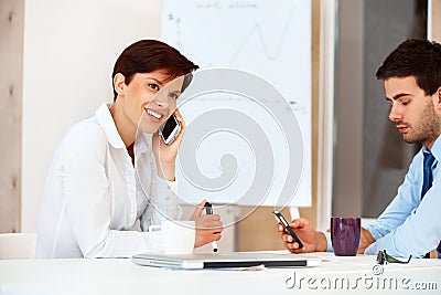 Bussiness people Using Cell Phones in a office Stock Photo