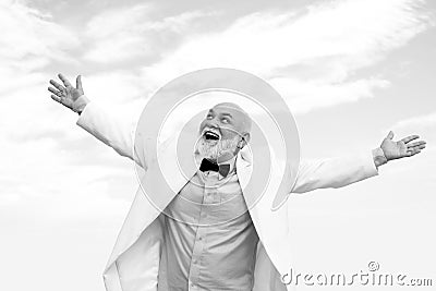 Bussiness success. Old senior mature man. Vintage successful male bussinessman in white suit having fun. Stock Photo