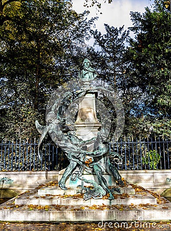 A bust of the French artist Eugene Delacroix and a sculptural fantasy group in Luxembourg Palace gardens, Paris Editorial Stock Photo