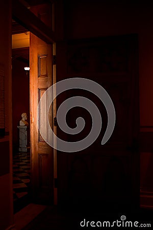 Bust sculpture in light door in shadows Editorial Stock Photo