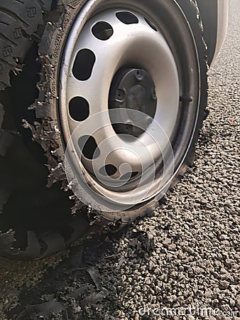 Busted tyre in the middle of the highway Editorial Stock Photo